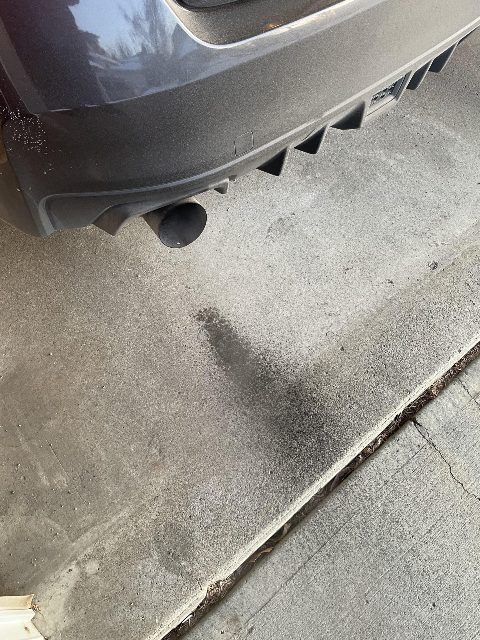 Black Soot on Ground from Exhaust
